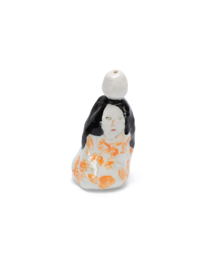 Black haired incense holder woman